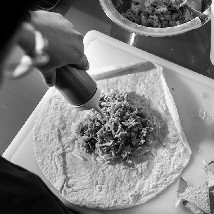 making of taco pulled chicken sandwich